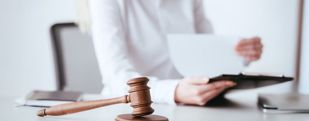 selective-focus-of-gavel-near-woman-holding-clipbo-2026-01-06-00-36-54-utc Large 2