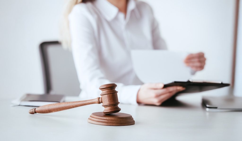 selective-focus-of-gavel-near-woman-holding-clipbo-2026-01-06-00-36-54-utc Large 2