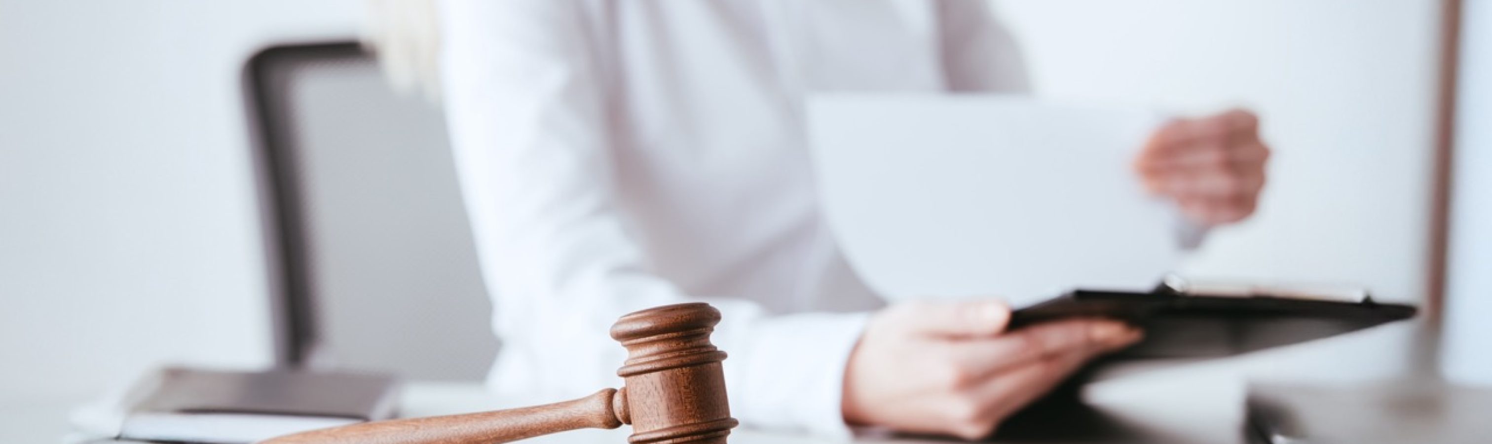 selective-focus-of-gavel-near-woman-holding-clipbo-2026-01-06-00-36-54-utc Large 2